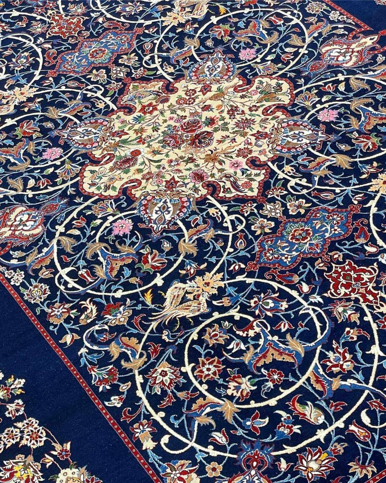 "Luxury navy blue Persian rug featuring intricate floral and arabesque patterns."